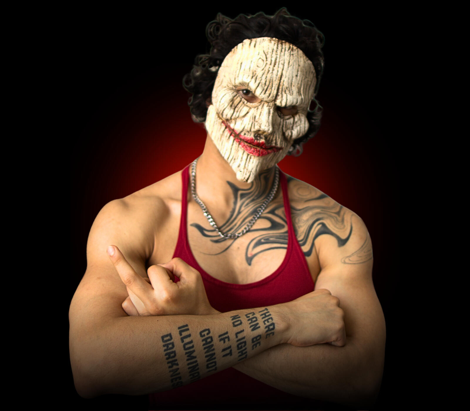 "Ready to Become Dangerous?" "Dark, masked portrait of physique coach symbolizing transformation from average to attention-commanding presence."